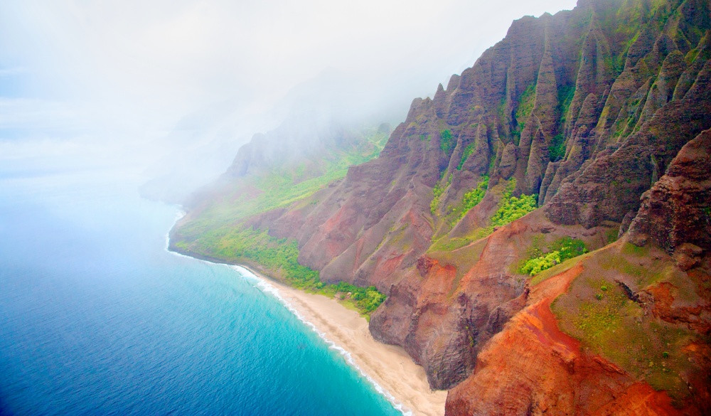 Kalalau Beach on rugged Na Pali Coast on north shore of Kauai, tropical island vacations