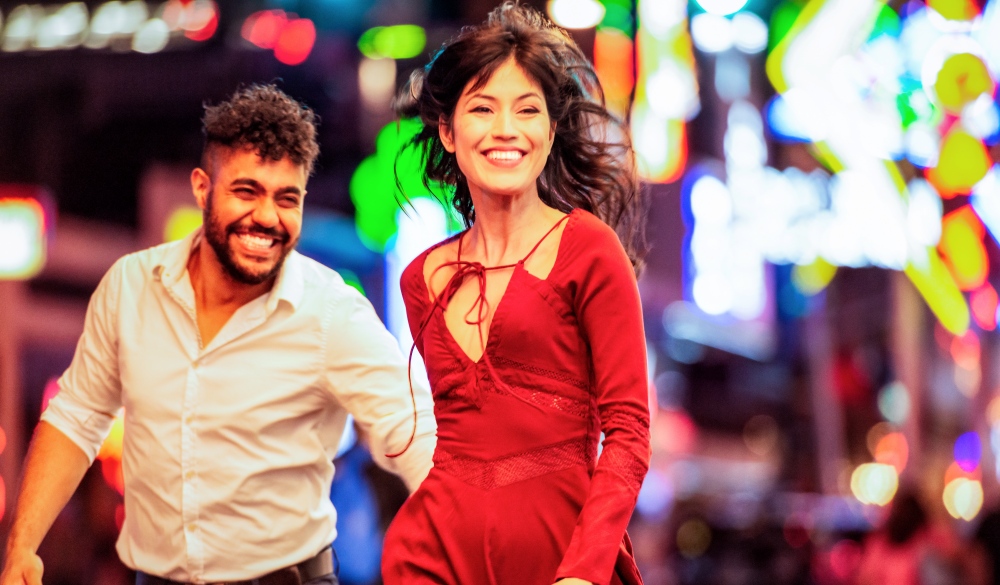 A young couple out together for an evening of fun among the neon lights of Las Vegas, Nevada.