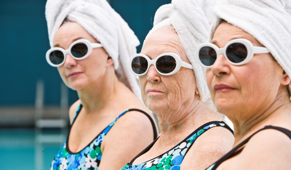 3 elderly ladies by poolside