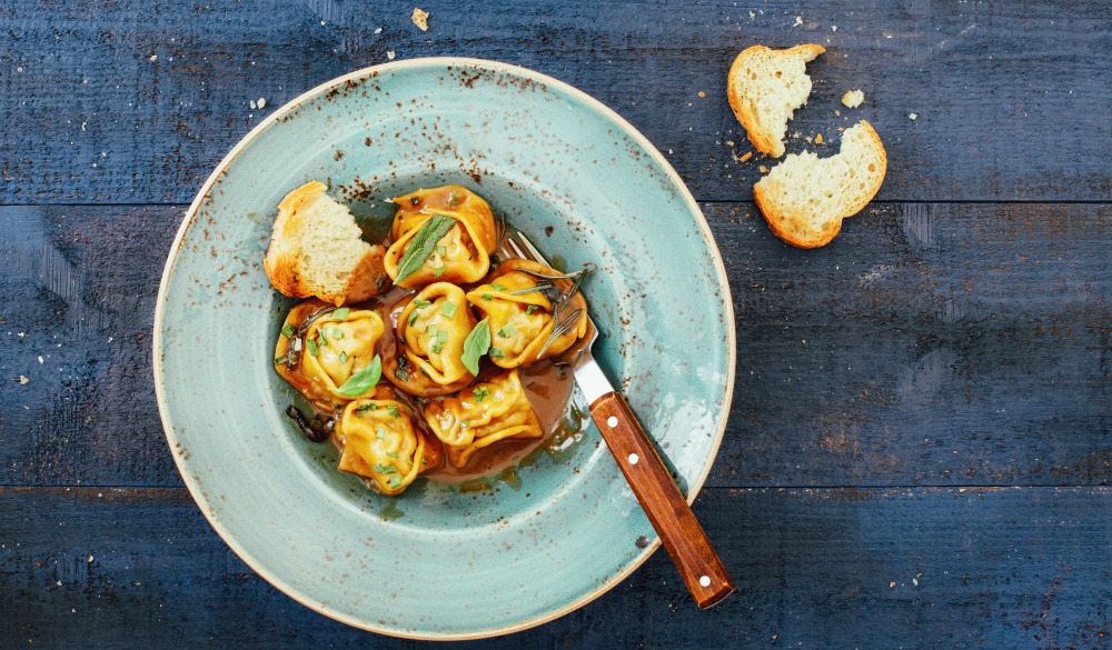 Italian tortelloni with meat and demi-glace sauce