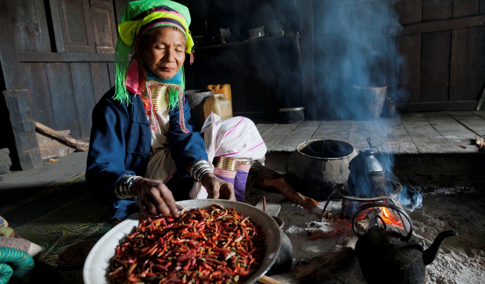 Burmese woman cooking traditional cuisine