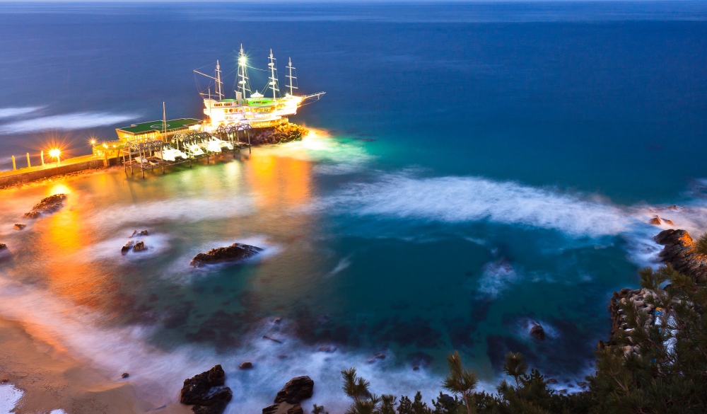 Night scape of boathouse on beach in Gangneung, Korea.