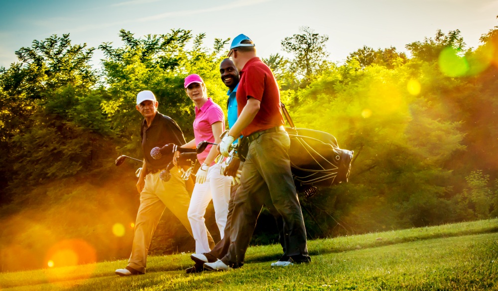 Four friends on golf course.