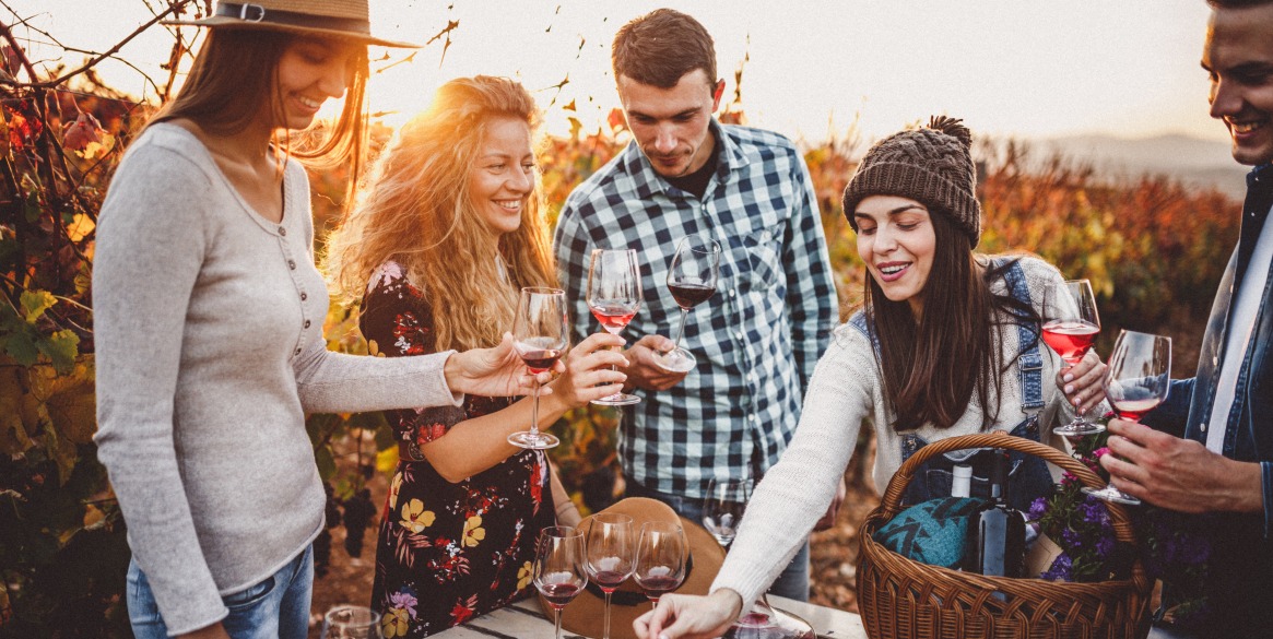 group of friends Wine tasting in a vineyard