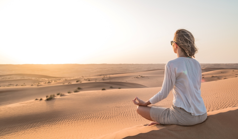 Woman Doing Yoga At Desert 