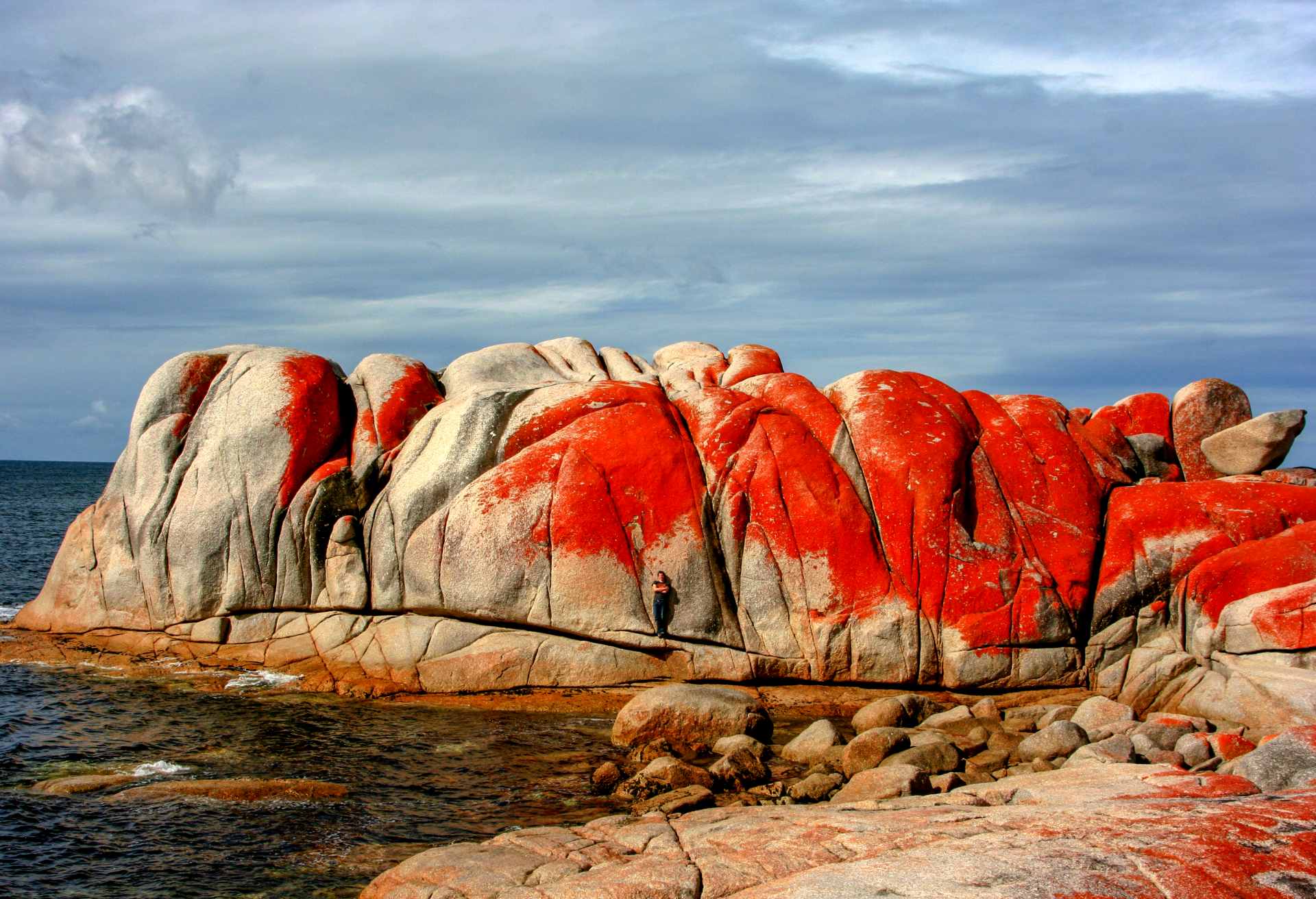 Rock Formation By Sea Against Sky