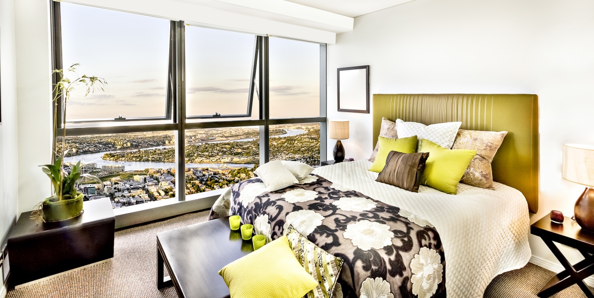 Colorful modern bed room near city view.