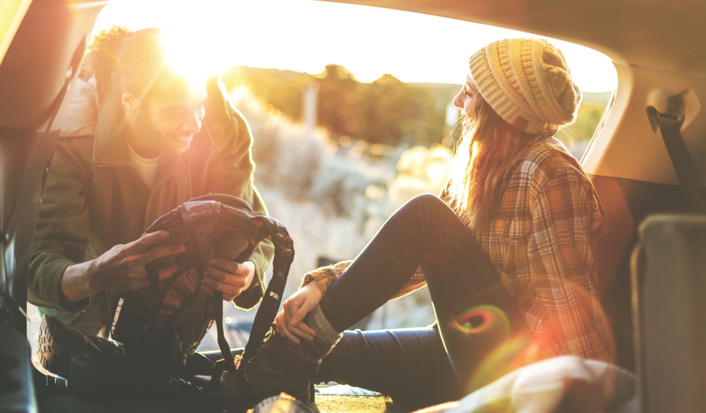 Couple Outdoor Adventure At Sunset Experiencing Golden Sunset Freedom in Western Colorado, road trip