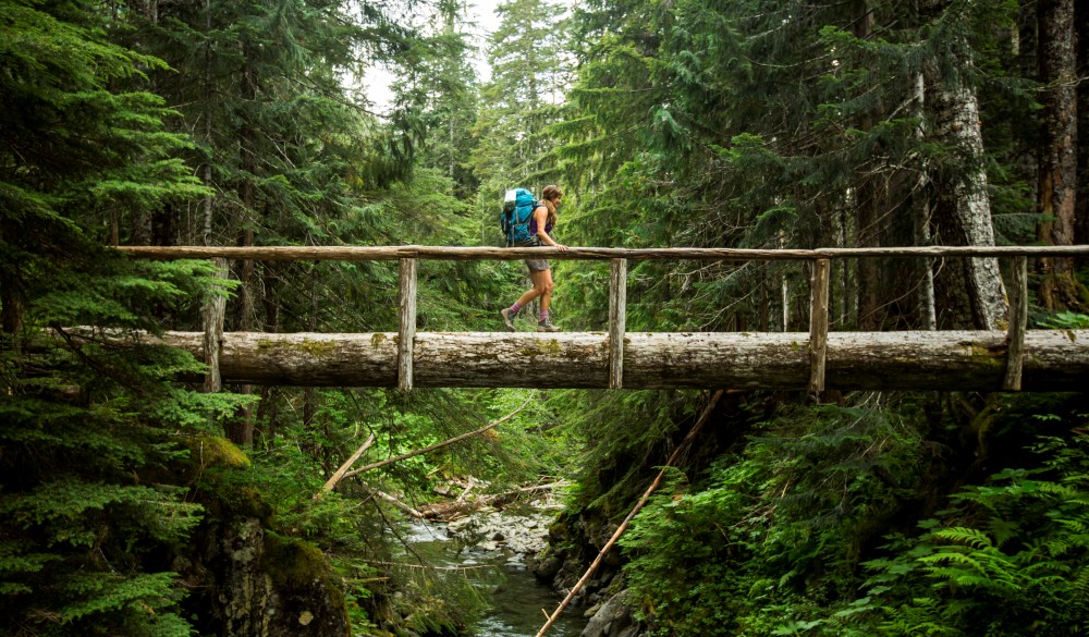 backpacking along a trail in the Olympic National Park, UNESCo site in the US