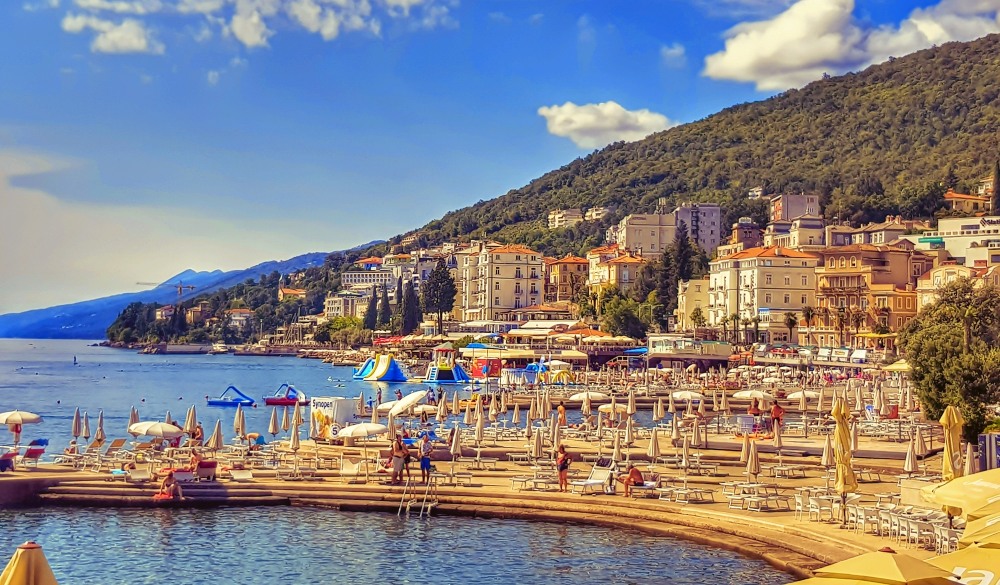 Sailboats Moored On Sea By City Against Sky, hidden travel gems