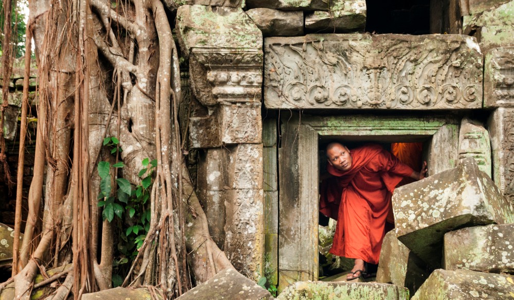 Monk exploring old ruins