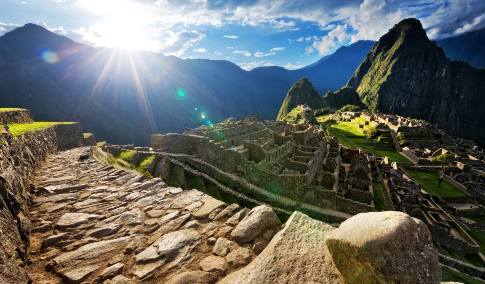 paved pathway overlooking Machu Picchu ruins, Peru, travel bucket list