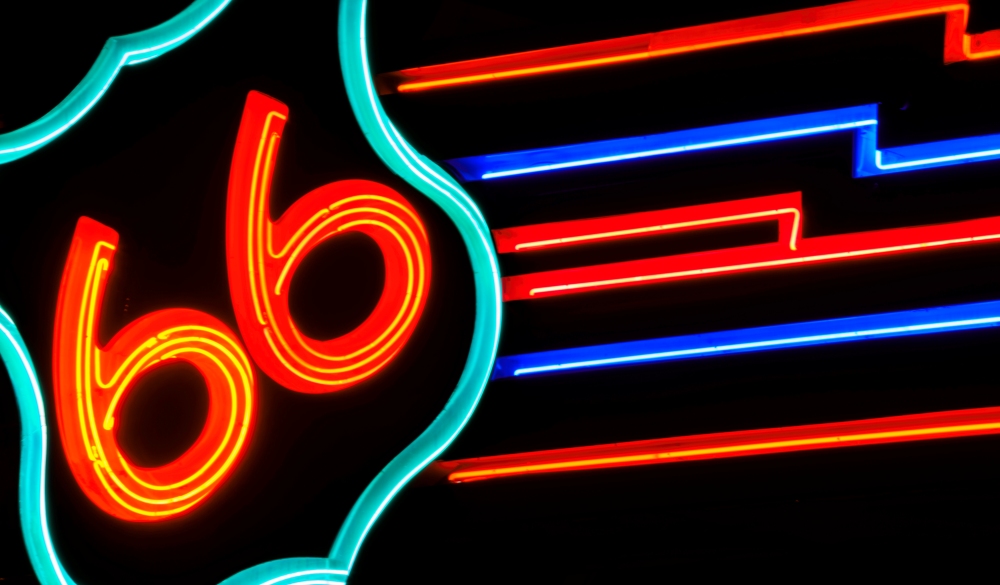 public street neon route 66 sign at night in Albuquerque