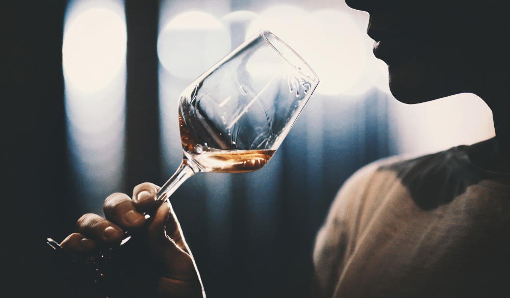 Wine tasting in wine cellar.