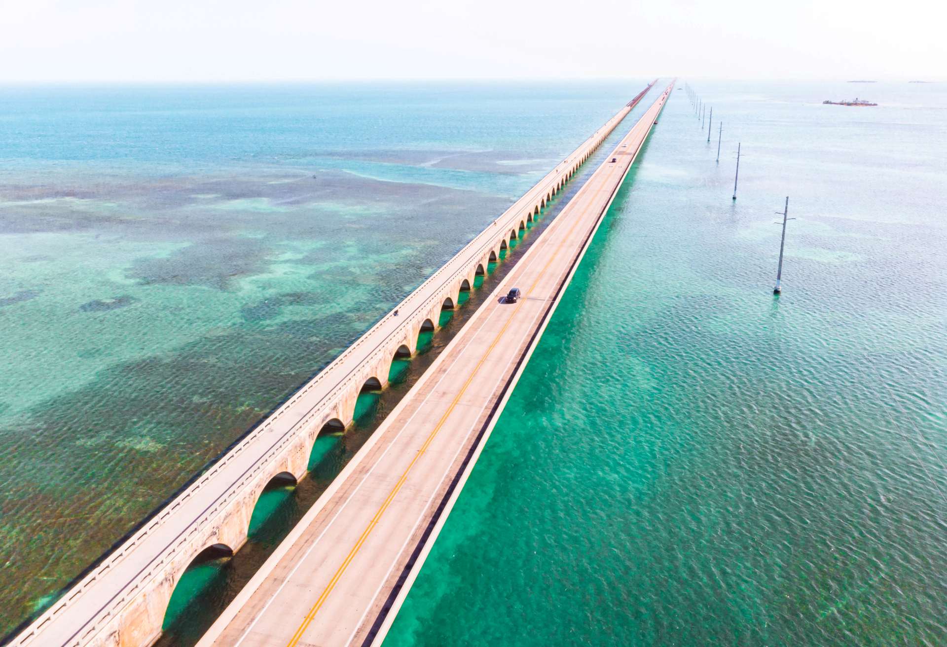 Drone view of the Overseas Highway in Florida Keys with turquoise color and infinite road.