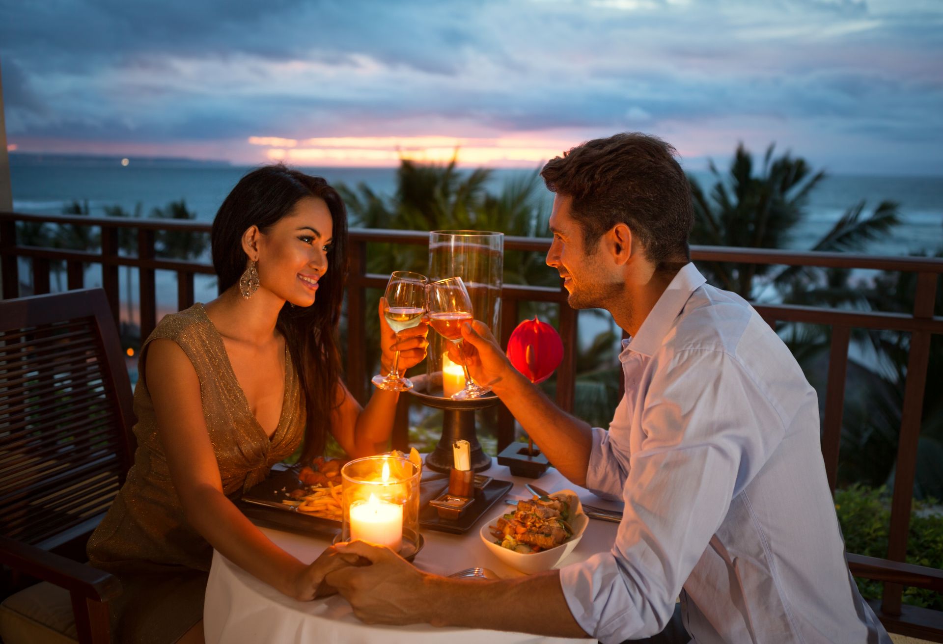 young couple enjoying a romantic dinner by candlelight,