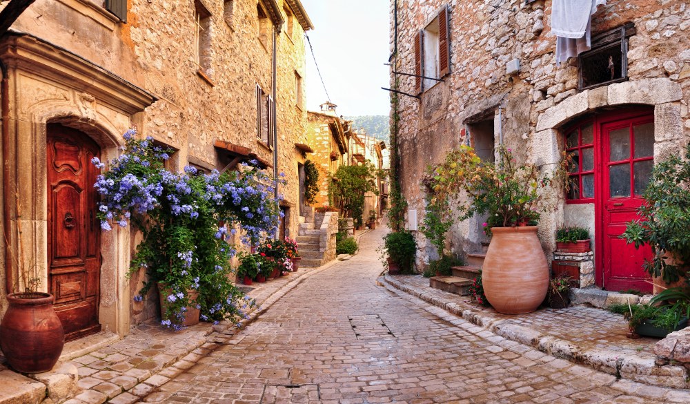 Old French village houses and cobblestone street