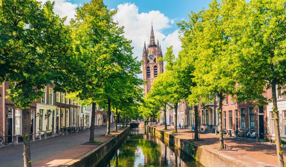 Canal with Leaning Church Tower in Delft Netherlands