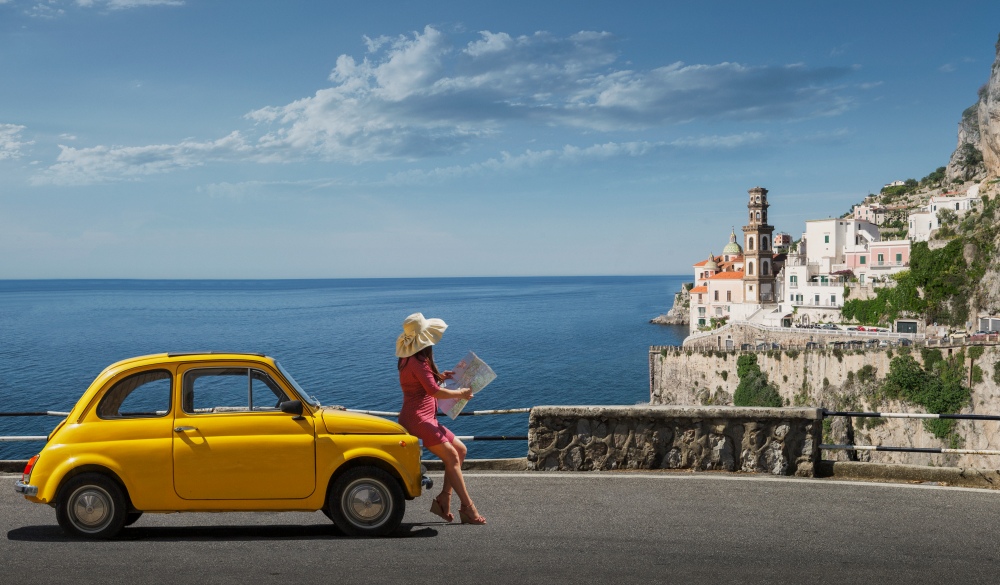 Woman holding map, Italian road trip