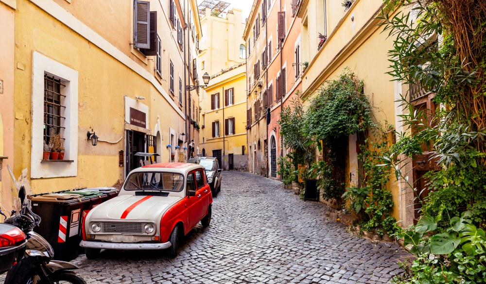 Cobbled street in Trastevere with old vintage car