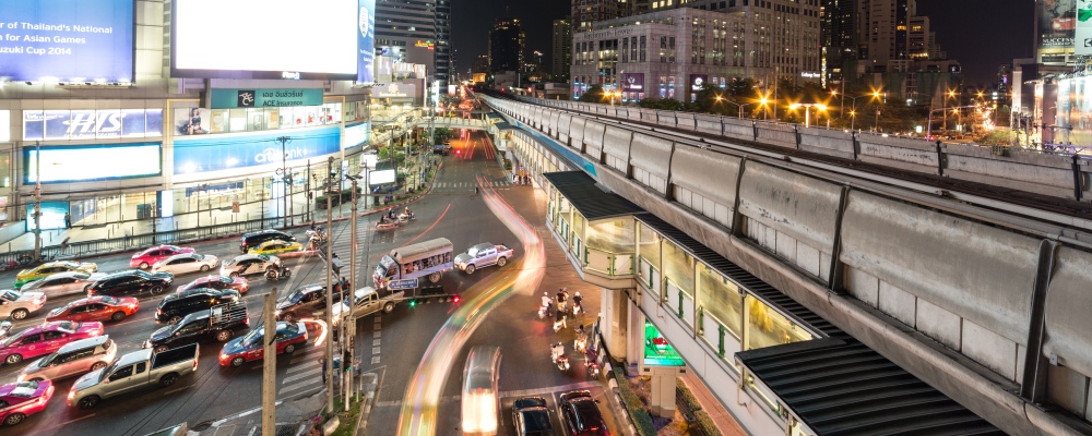 The famous Asok intersection along Sukhumvit road, the main road in downtown Bangkok, Thailand capital city at night