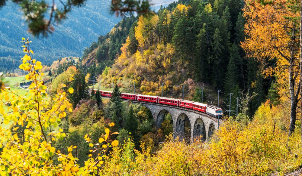 Bernina Express train in autumn, Filisur, Switzerland, scenic train ride