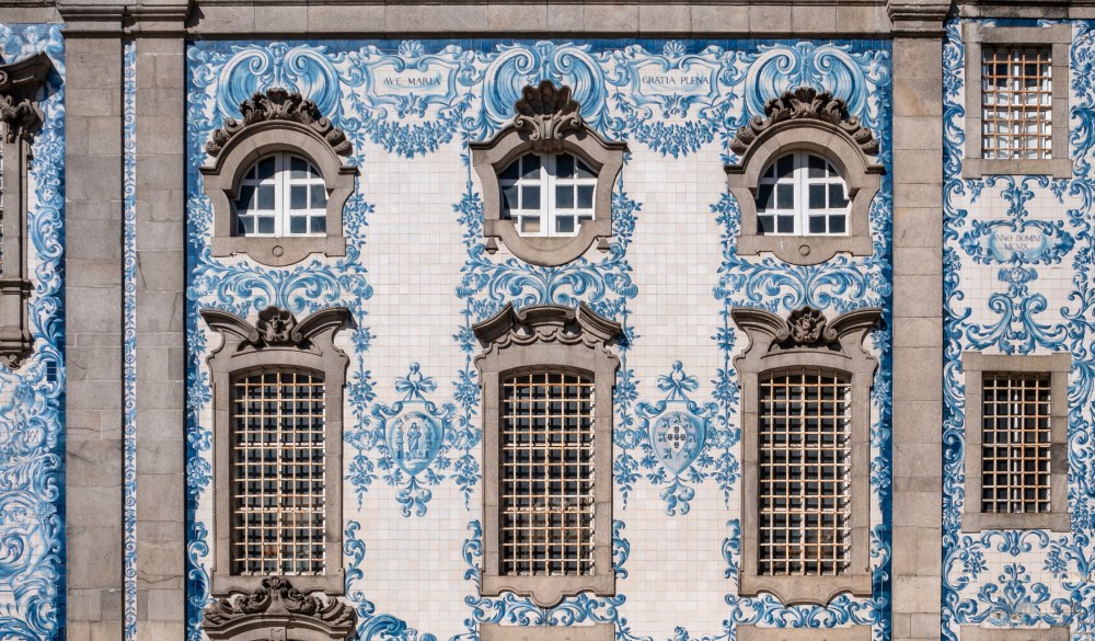 Porto Portugal, Igreja do Carmo Connected to its twin church by a house, this baroque church has a well-known tiled side facade. Porto Portugal