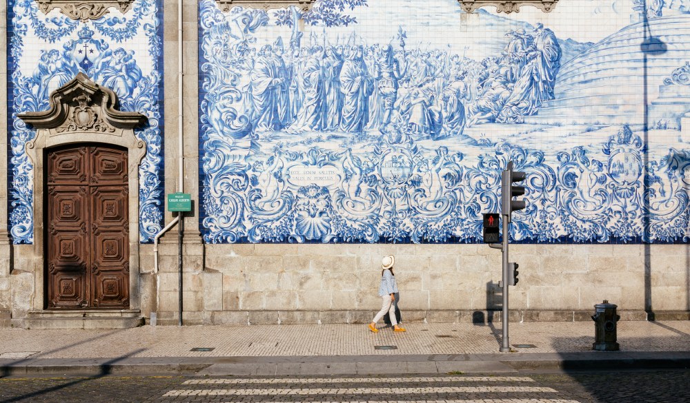 girl walking through the streets in Porto