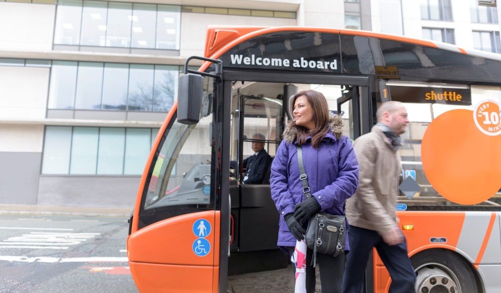 Passengers getting off electric bus