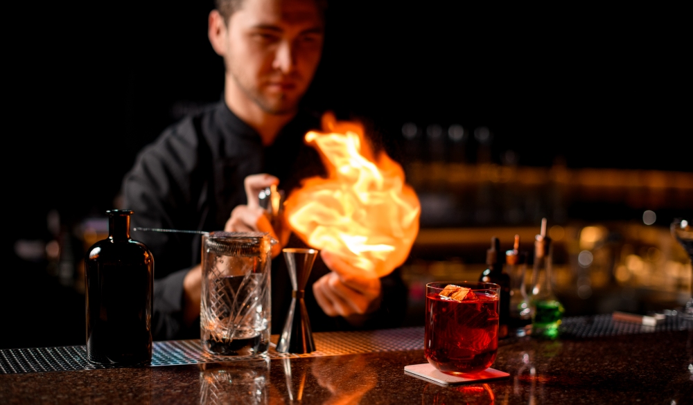 bartender serving the red alcoholic cocktail