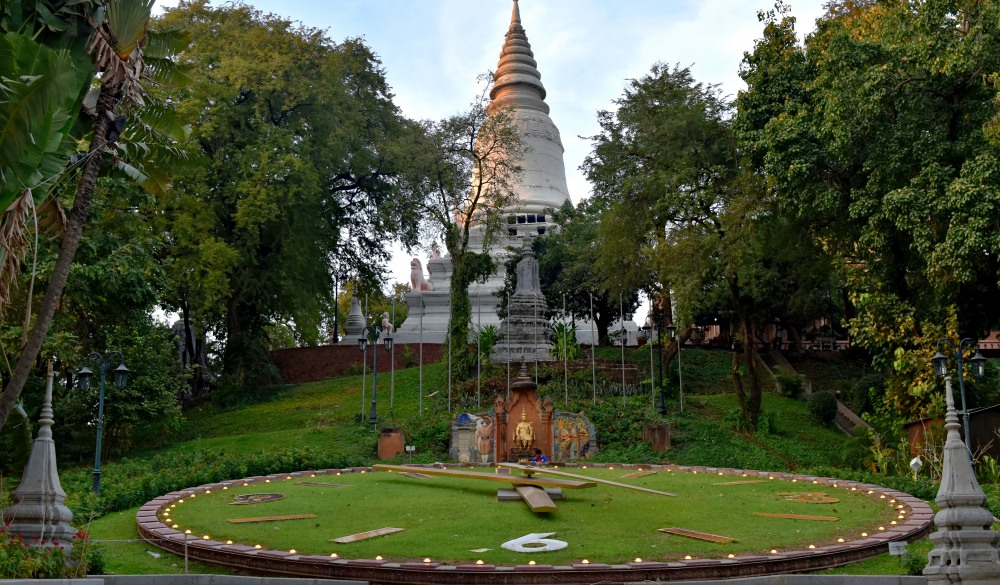 Old Wat Phnom Buddhist stupa temple and city clock of Phnom Penh, Cambodia