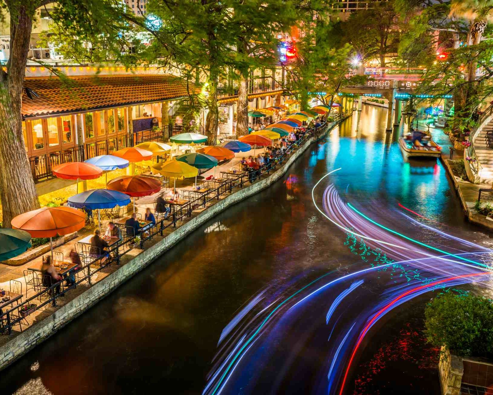 San Antonio Riverwalk, Texas, scenic river canal tourism umbrellas night