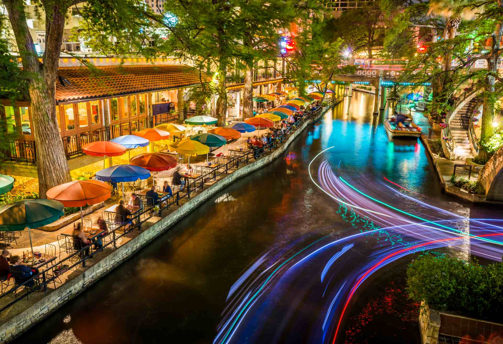 San Antonio Riverwalk, Texas, scenic river canal tourism umbrellas night