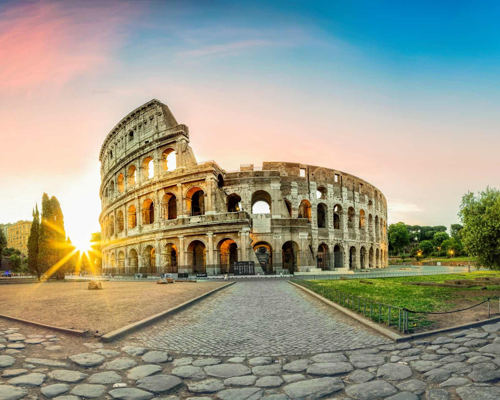 Colosseum in Rome and morning sun, Italy