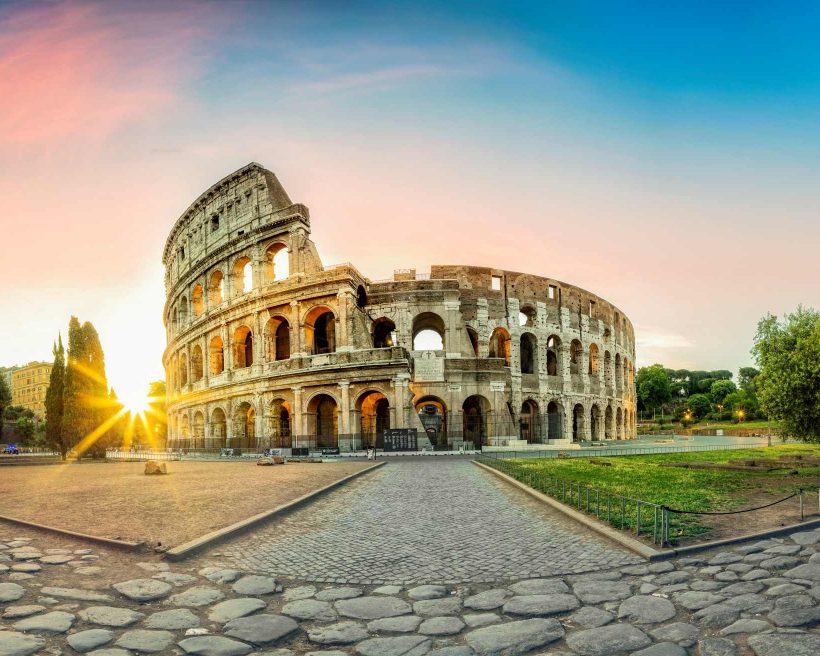 Colosseum in Rome and morning sun, Italy