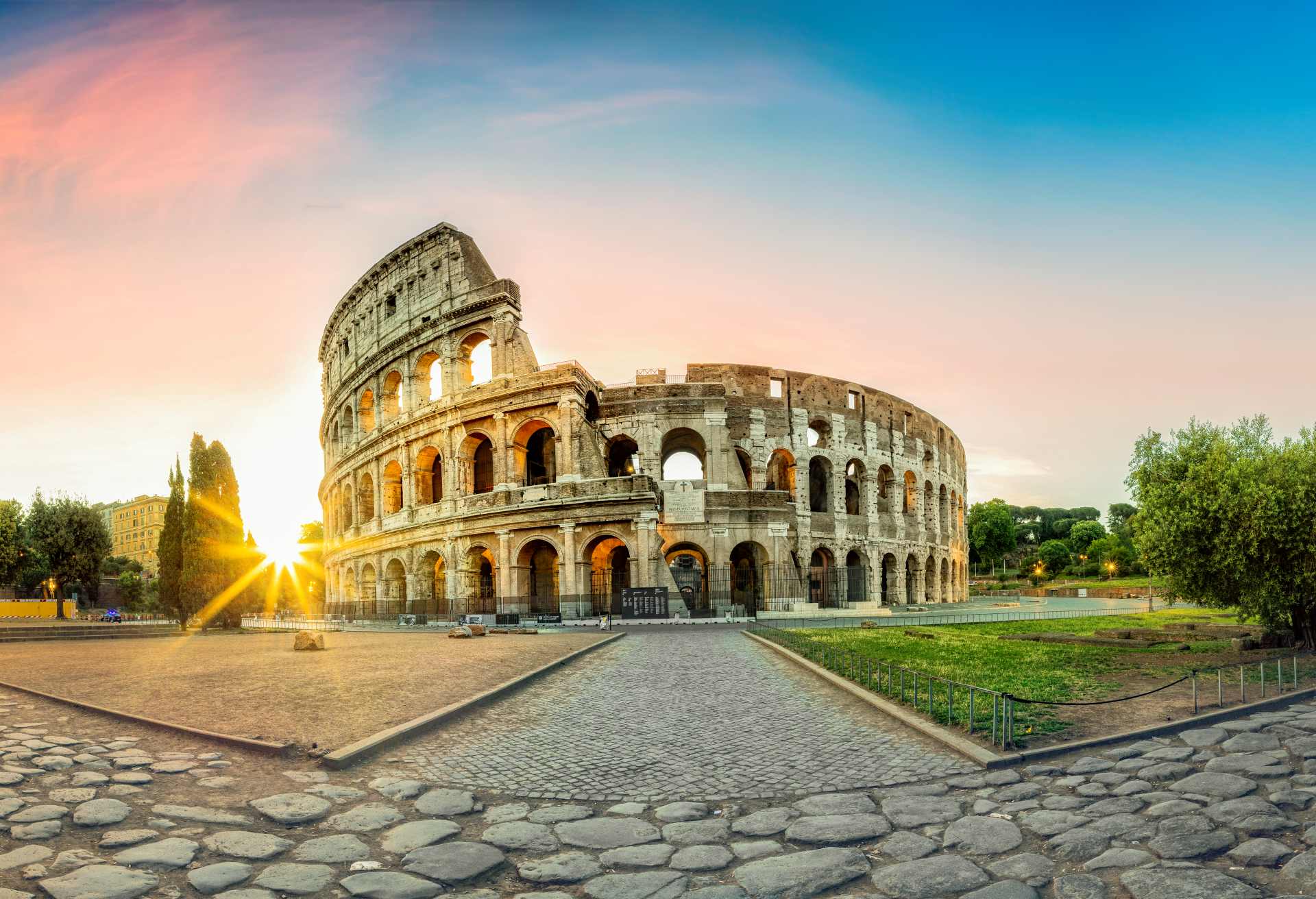 Colosseum in Rome and morning sun, Italy