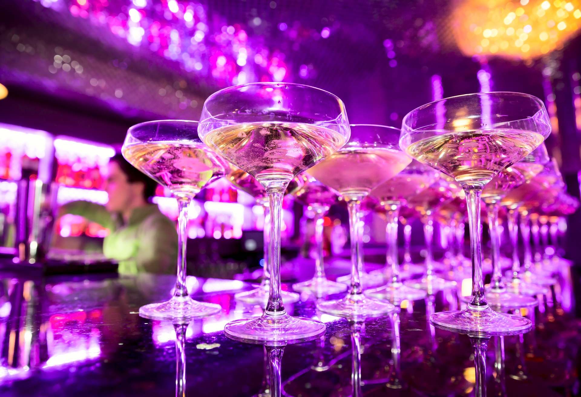Glasses of champagne on bar