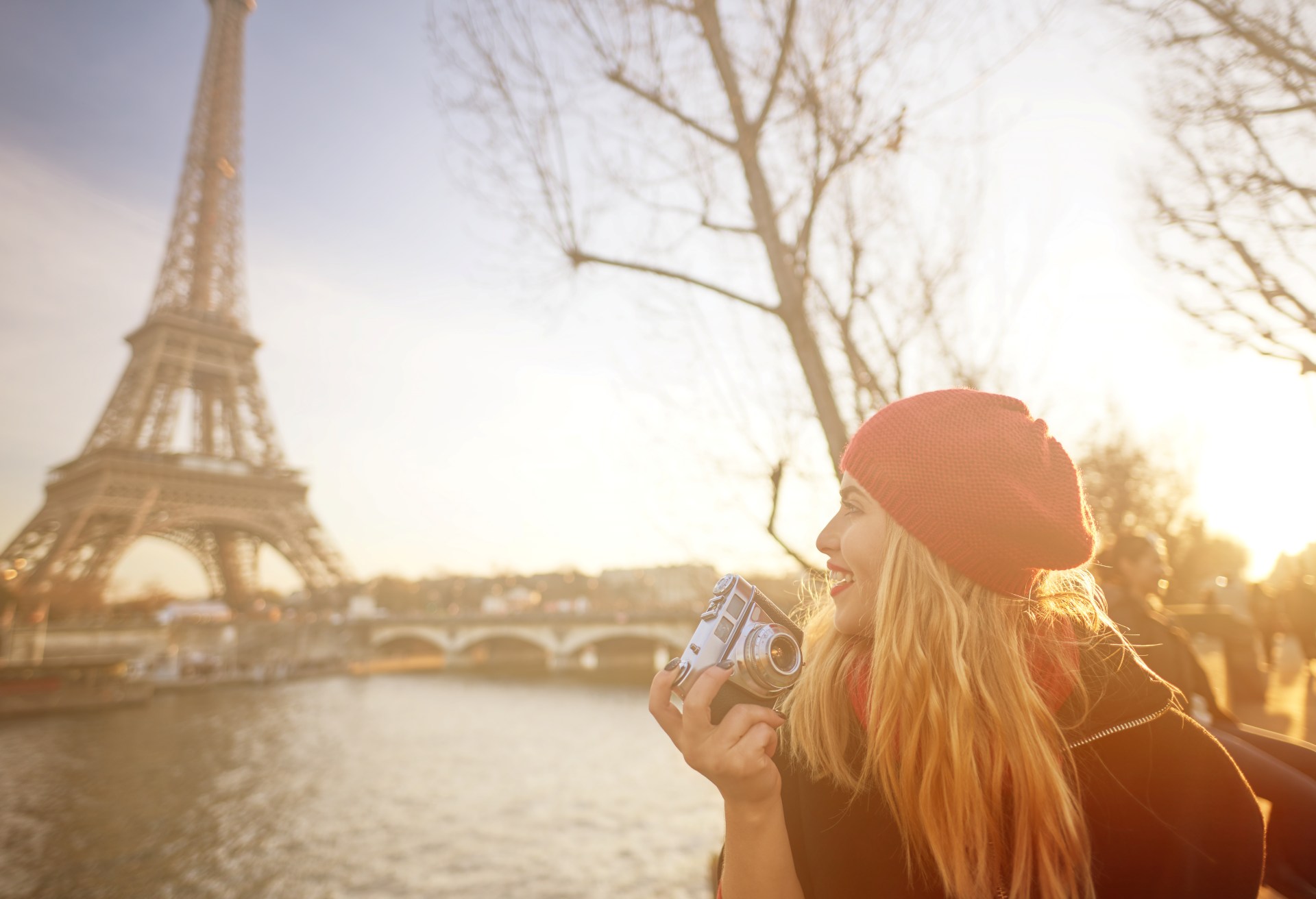 tourist woman in Paris holding camera