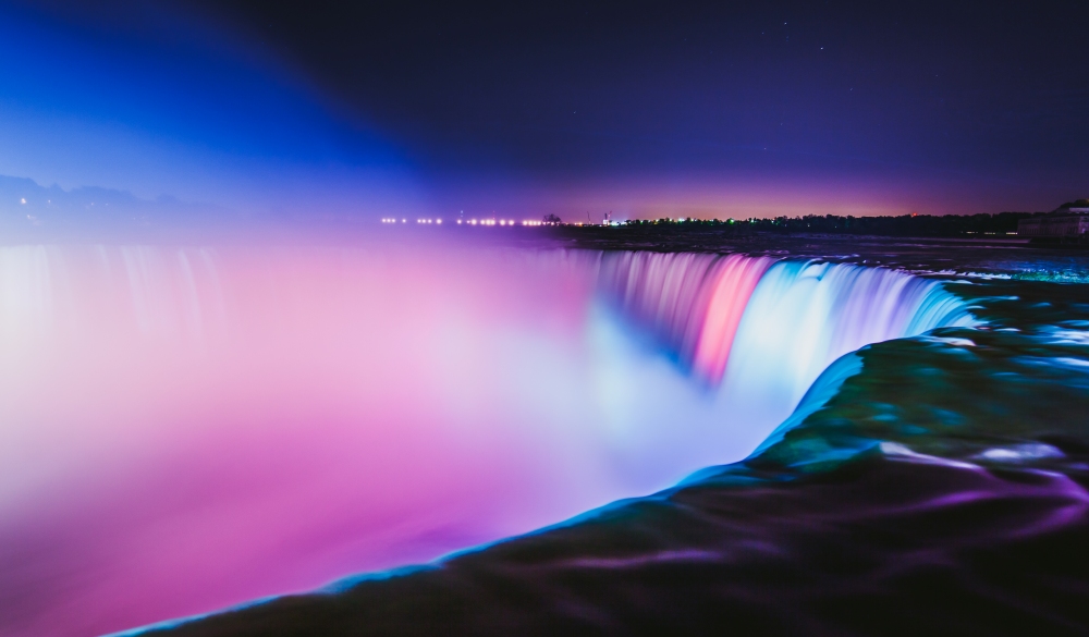 Niagara Falls at night with colorful lighting