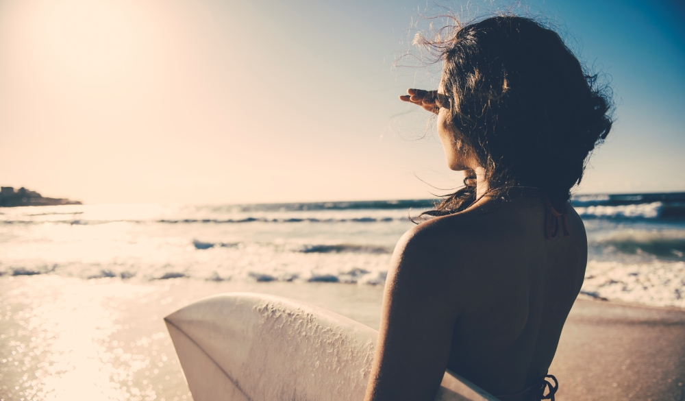 Surf girl looking into distance