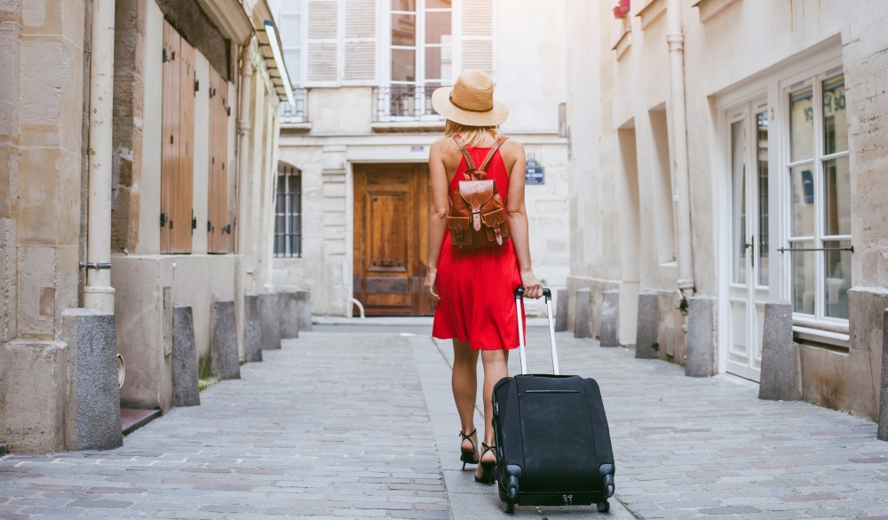 tourist walking with suitcase on the street