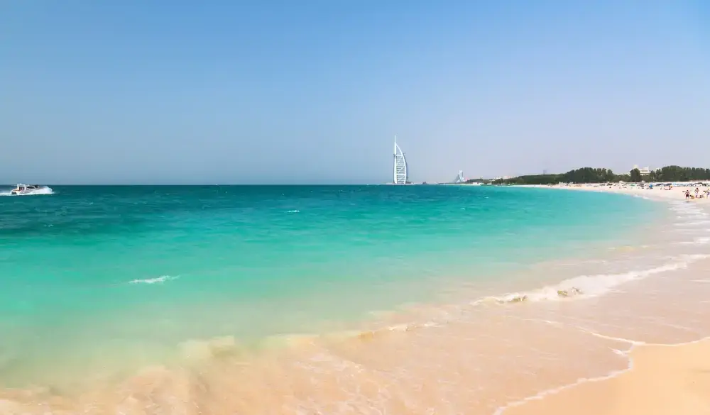 Public beach with turquoise water in Dubai, UAE; Shutterstock ID 211163284
