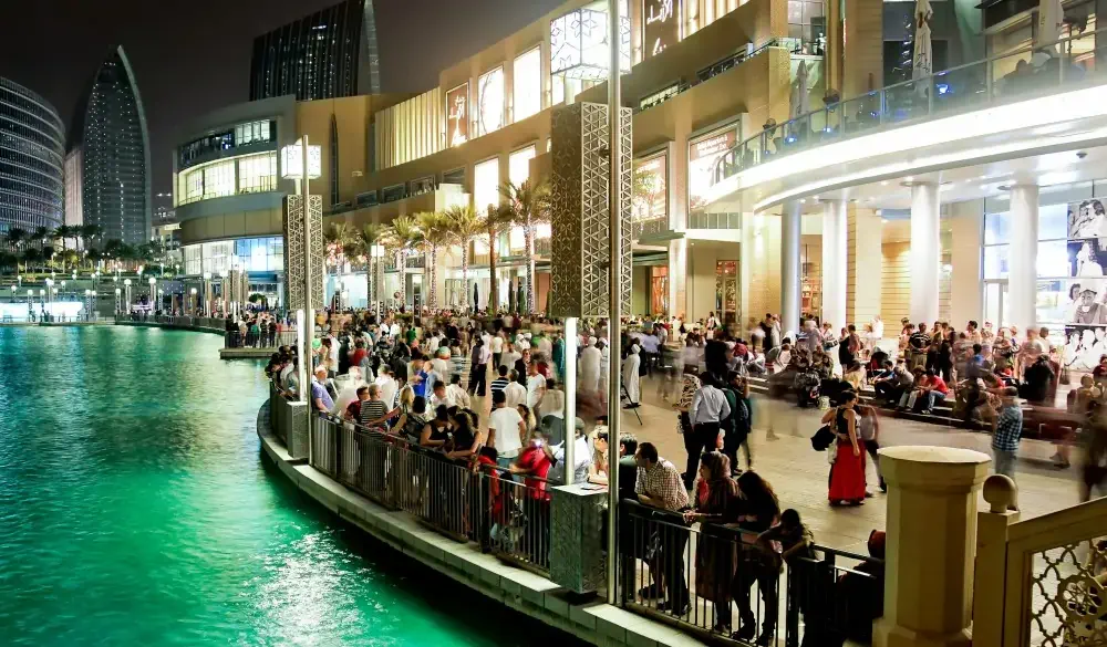 Busy evening at Dubai downtown, Dubai Mall, Dubai fountain. People waiting for fountain to play its show.