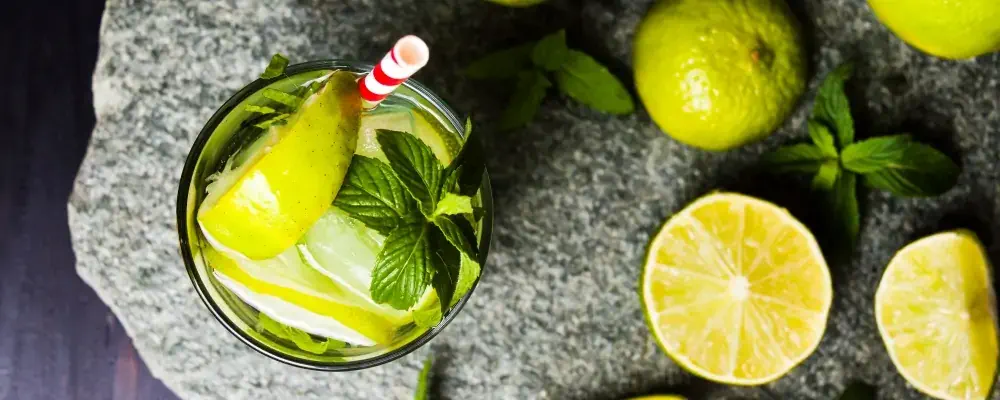 Diet drink of water with cucumber, mint and lemon in glass