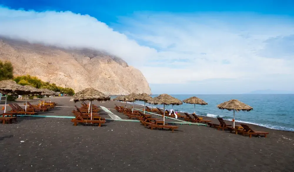 Black sand Santorini beach, Greece.