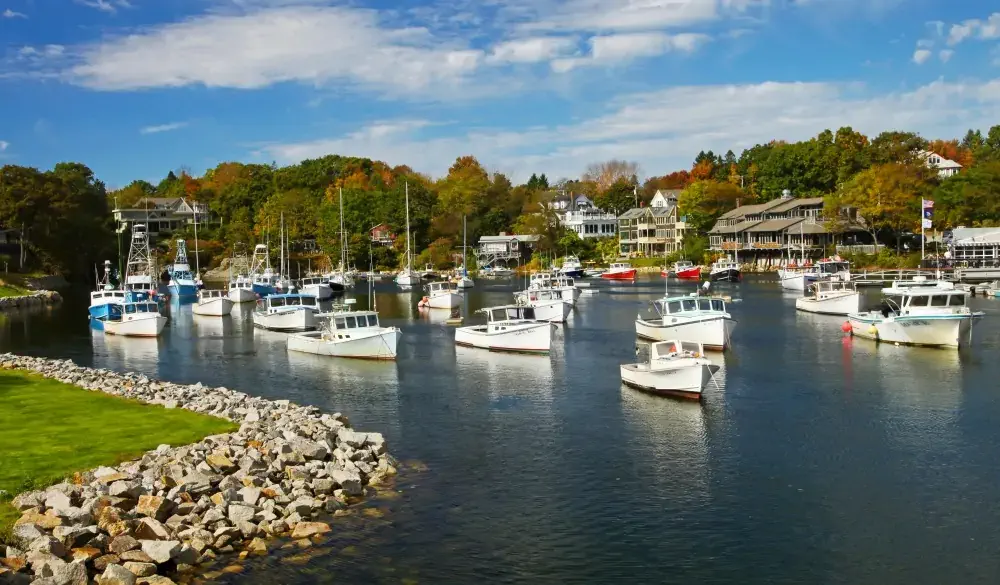 Perkins Cove is a lovely spot to spend a summer vacation evening or in fall day when the trees change their colors.