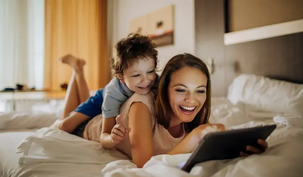 Close up photo of a mother and son using a digital tablet