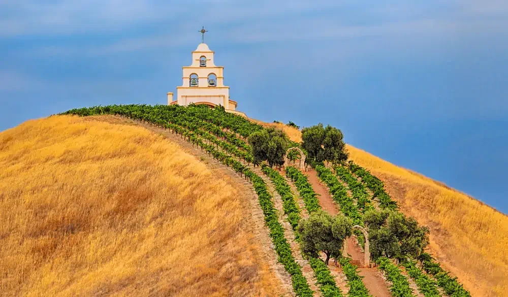 This is a photo of a small chapel on a hill. The chapel can be seen while driving on Highway 46 east of Paso Robles, California.