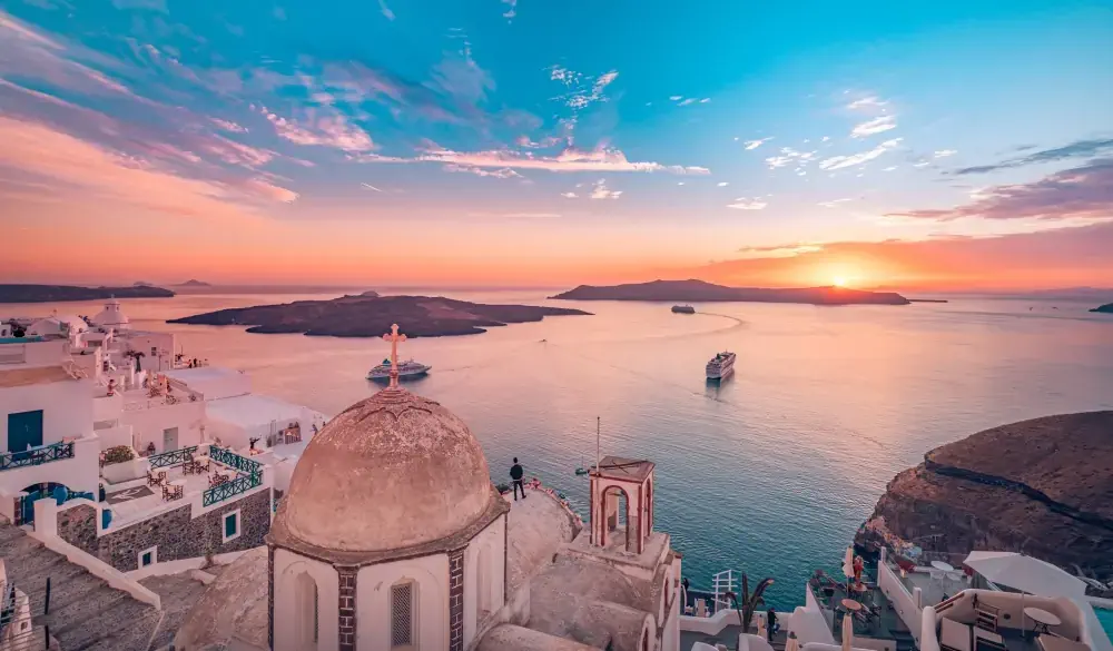 Amazing evening landscape of Fira, infinity pool caldera view Santorini, Greece with cruise ships at sunset. Cloudy dramatic sky sunset, wonderful summer scenery, travel vacation, holiday. Inspire