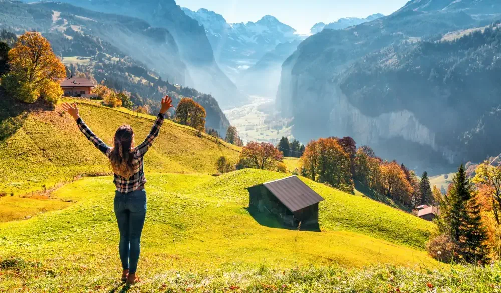 young woman enjoys the view from Wengen